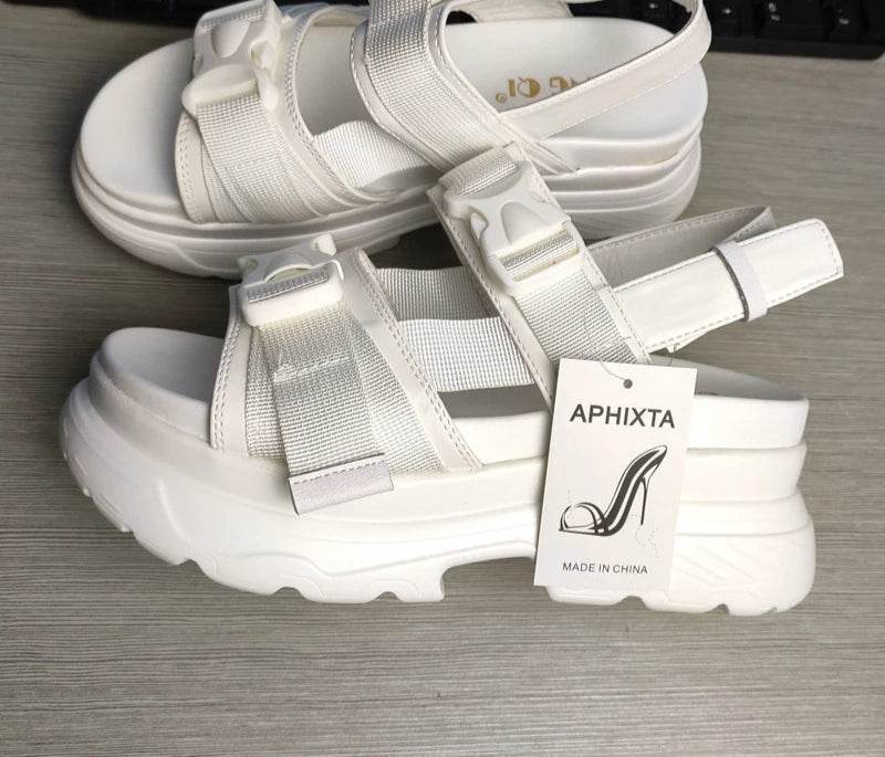 Side view of summer buckle strap wedge shoes

