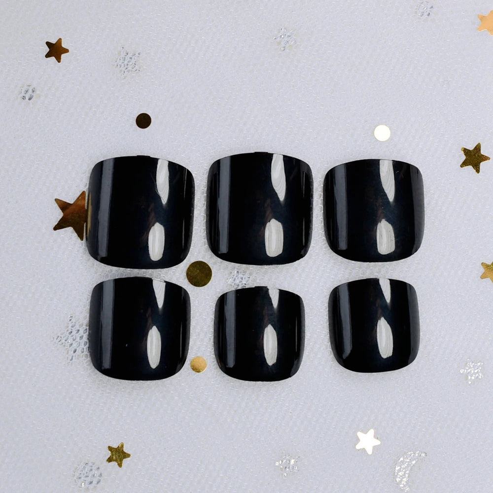 Set of six black nail polish bottles on a light gray background with decorative stars.