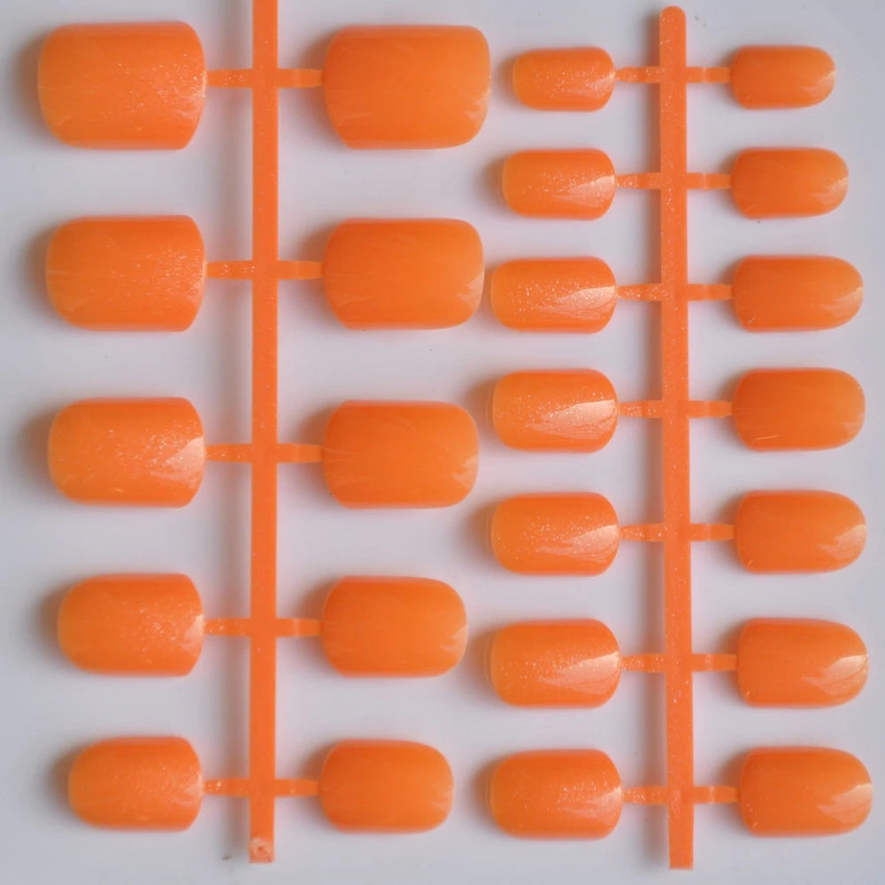 Orange plastic nail set on a white background