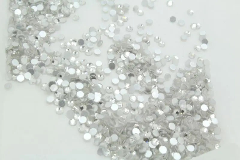 Close-up of silver glitter on a white background