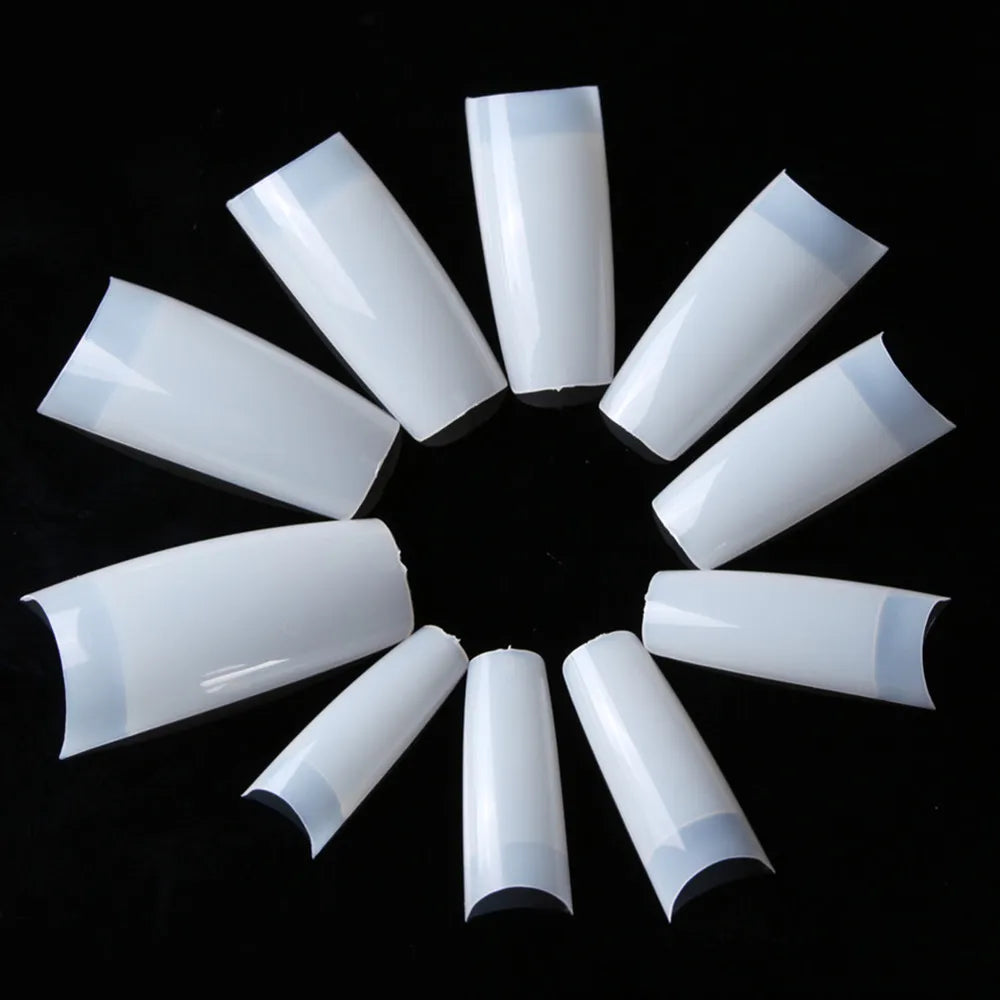 White cylindrical objects arranged in a circular pattern on a black background