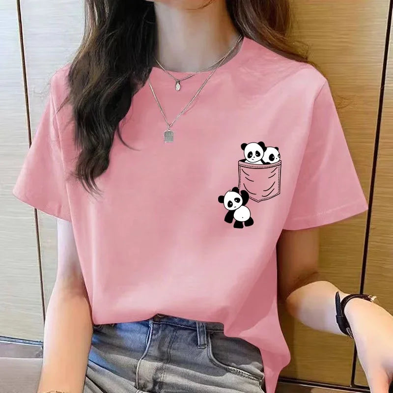 Person wearing a pink t-shirt with panda designs on it.
