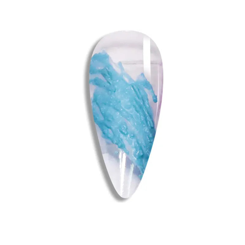 Teardrop-shaped nail art design with blue and white pattern on a white background