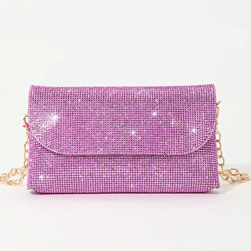 A close-up of a pink diamond-encrusted evening clutch, showcasing its intricate details.

