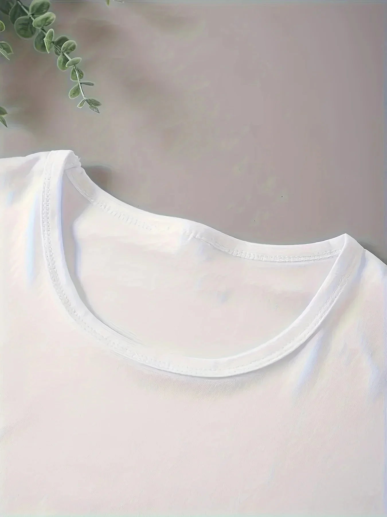 Close-up of a white shirt collar with a minimal background