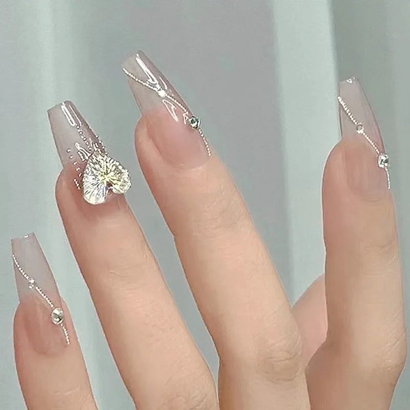 Nails with decorative elements on a neutral background