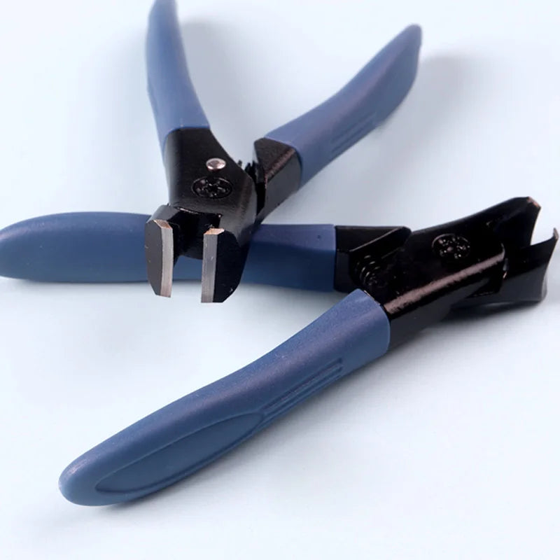 Pair of blue-handled nail cutters on a white background