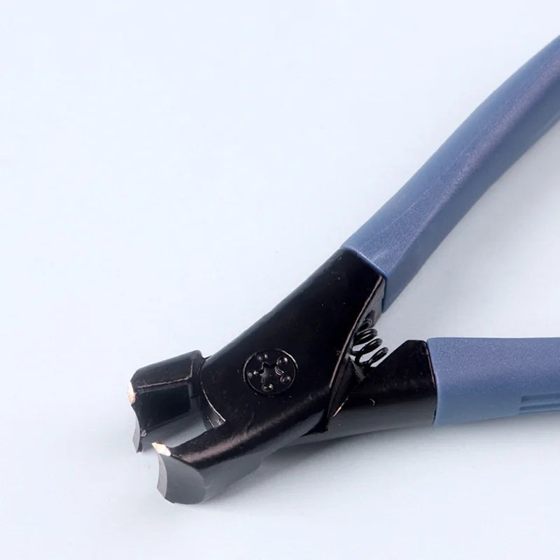 Close-up of a blue and black tool on a white background
