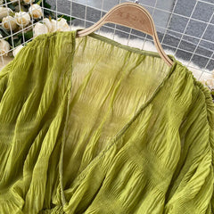 Sheer long sleeve blouse in purple, green, black, and white

