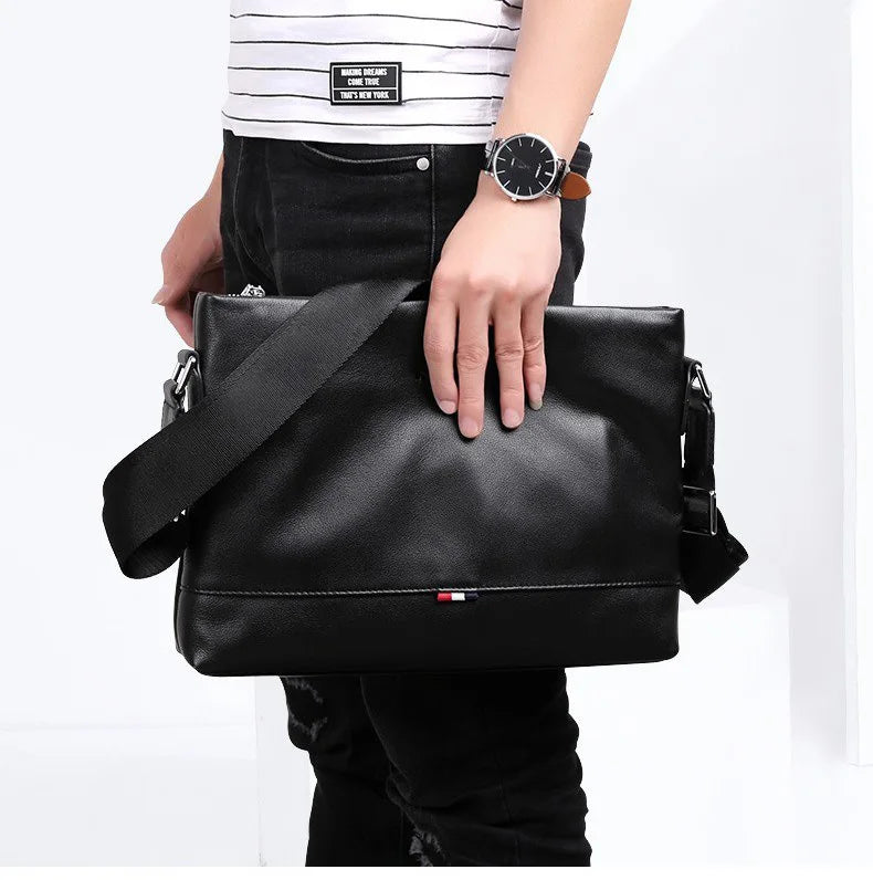 A close-up of the brown leather crossbody bag, highlighting its texture and vintage-inspired details.

