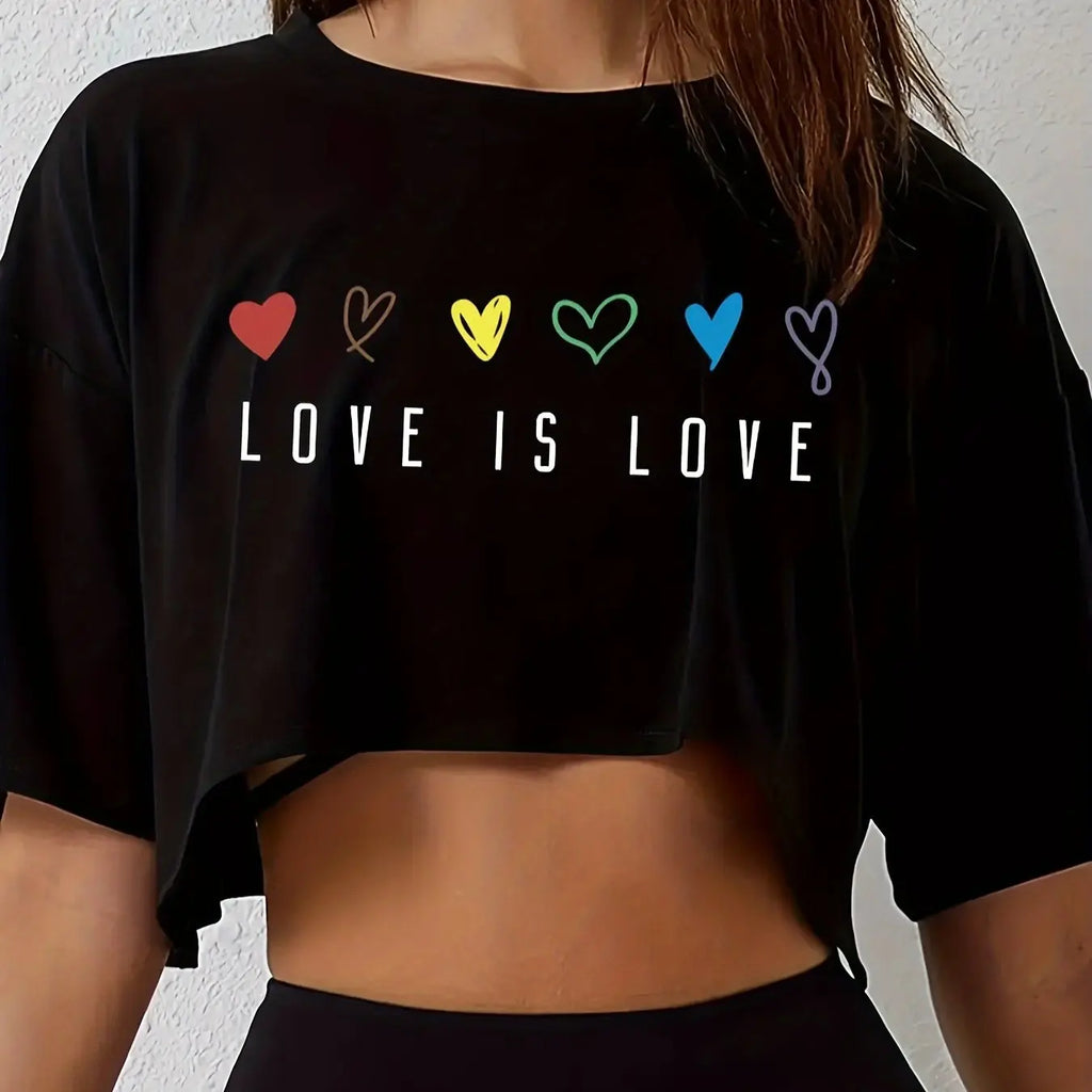 Black crop top with 'LOVE IS LOVE' text and colorful hearts on a plain background