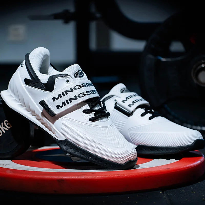 White sneakers with black accents on a red and black surface