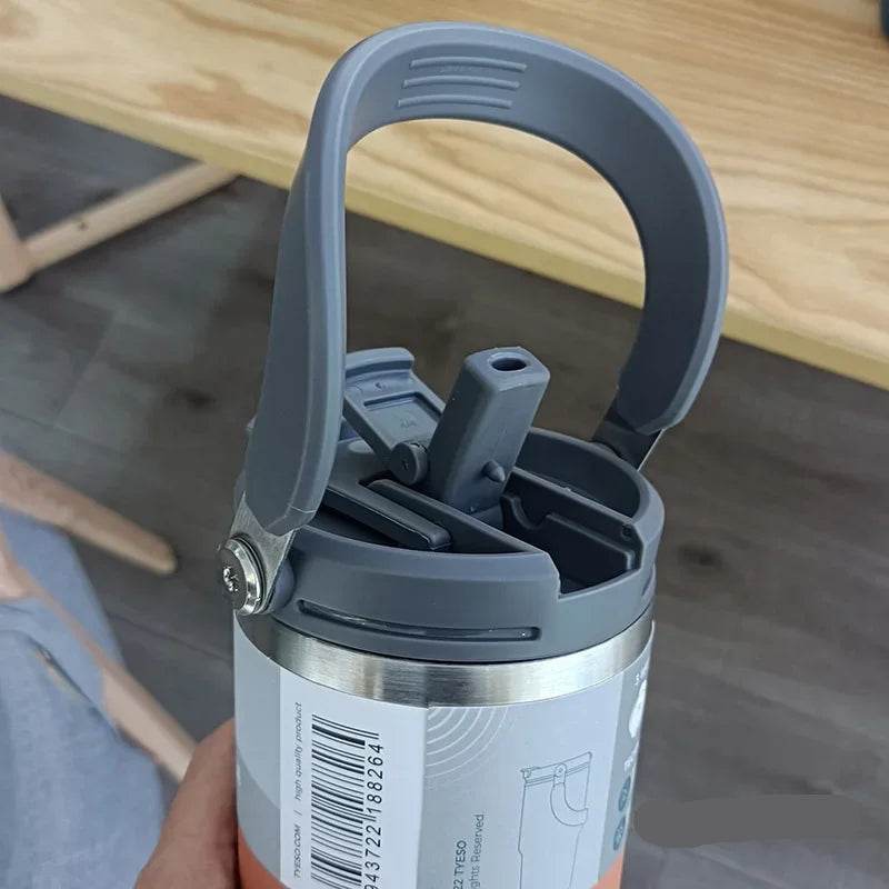 The travel mug next to a backpack or travel gear, suggesting its use for on-the-go activities.