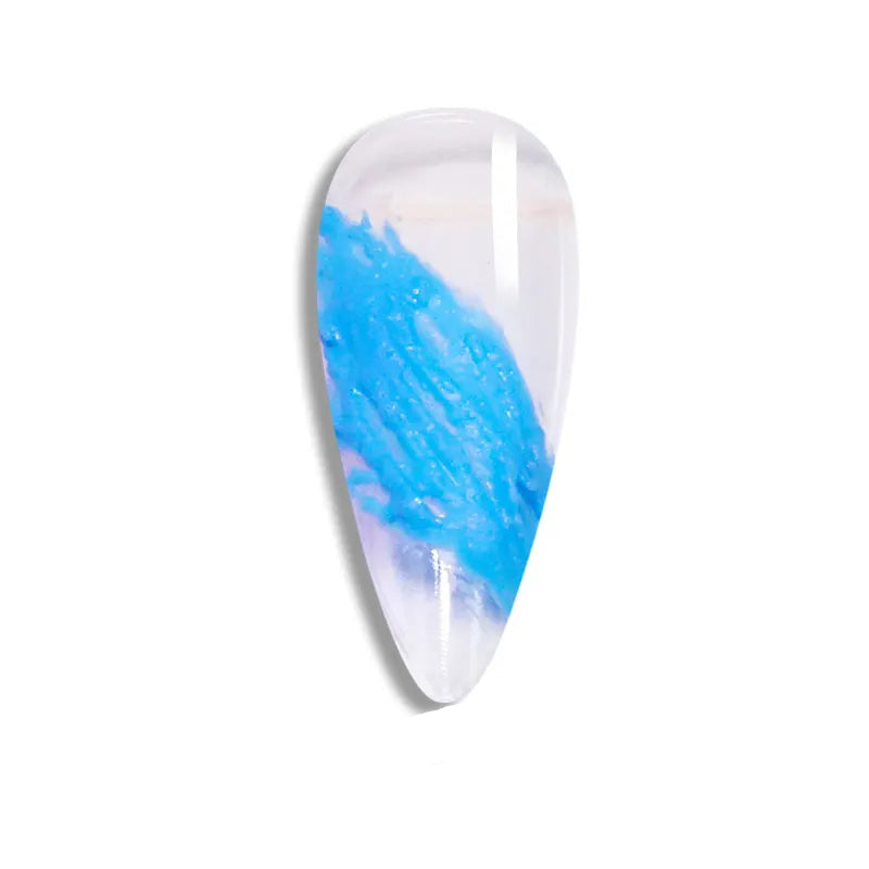 Nail art tip with blue and white design on a white background