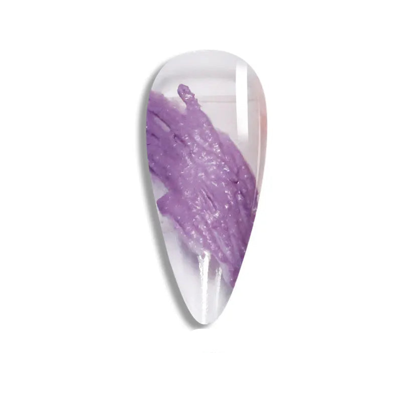 Nail art tip with purple design on a white background