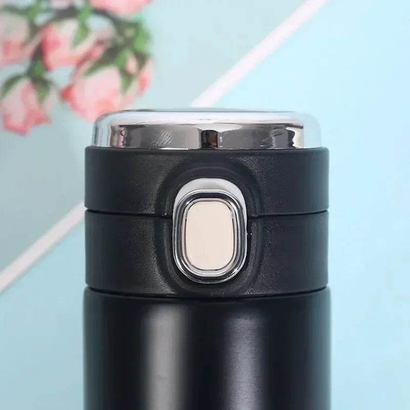 The thermos with a cold beverage, possibly with condensation visible.

