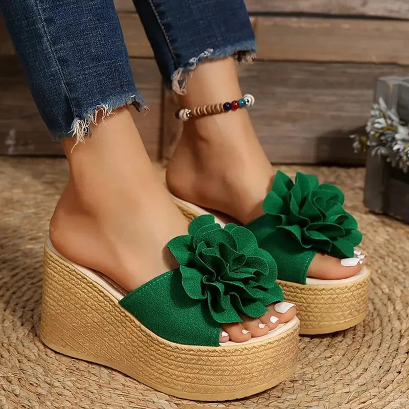 Flower appliqué detail on women’s wedge sandals

